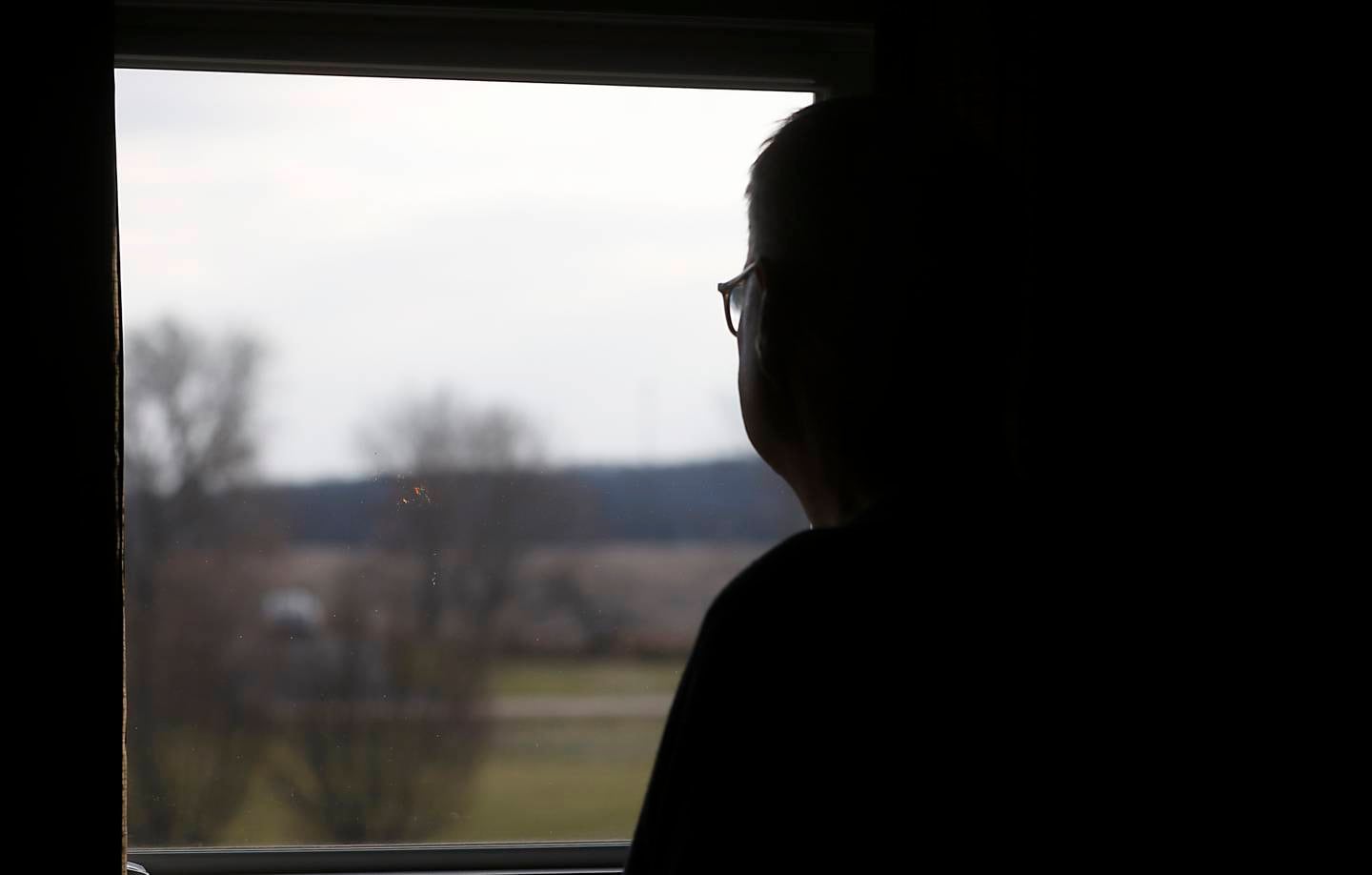 Ron Bryant looks out of his office window at a farm field Monday, Nov. 28, 2022, from their home at 8219 Country Shire Lane in Fox Lake. The land was purchased by Super Aggregates to develop into a gravel pit, an idea the Bryants and their neighbors oppose.