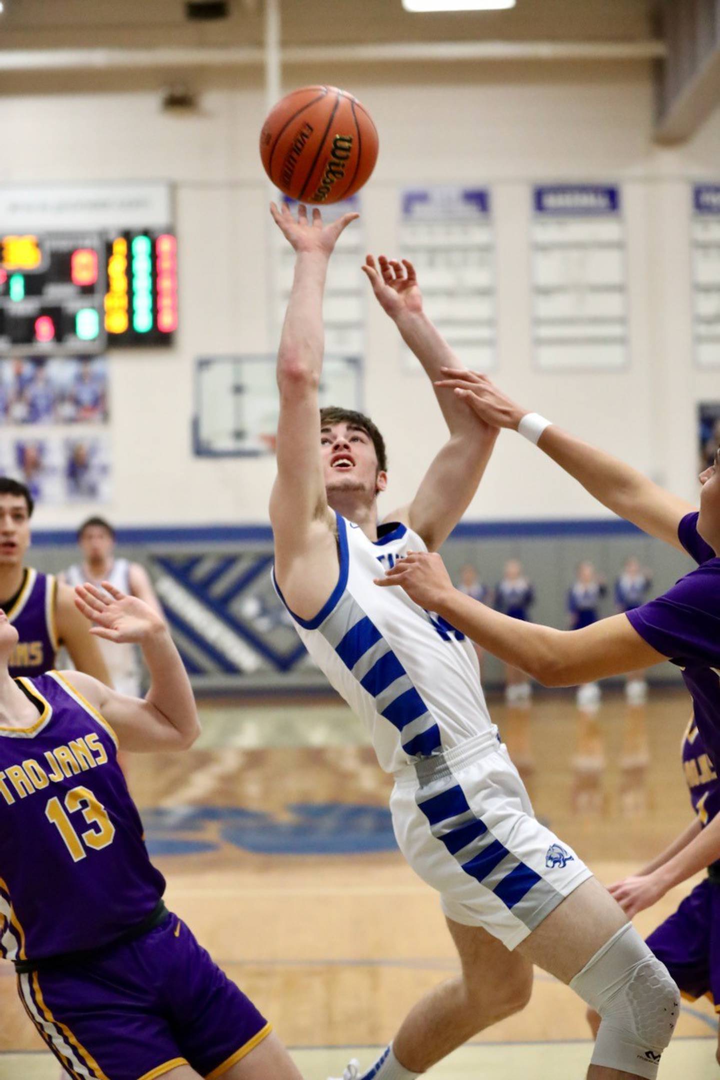 Princeton's Grady Thompson twists for a shot against Mendota Friday night at Prouty Gym.