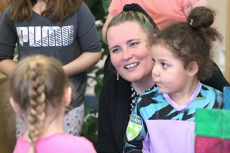 Laurel Copeland, Little Spartans Early Learning Program teacher at South Prairie Elementary School, talks to Jocelyn Walz (left) and Avery Anderson Wednesday, April 6, 2023, at the school in Sycamore.
