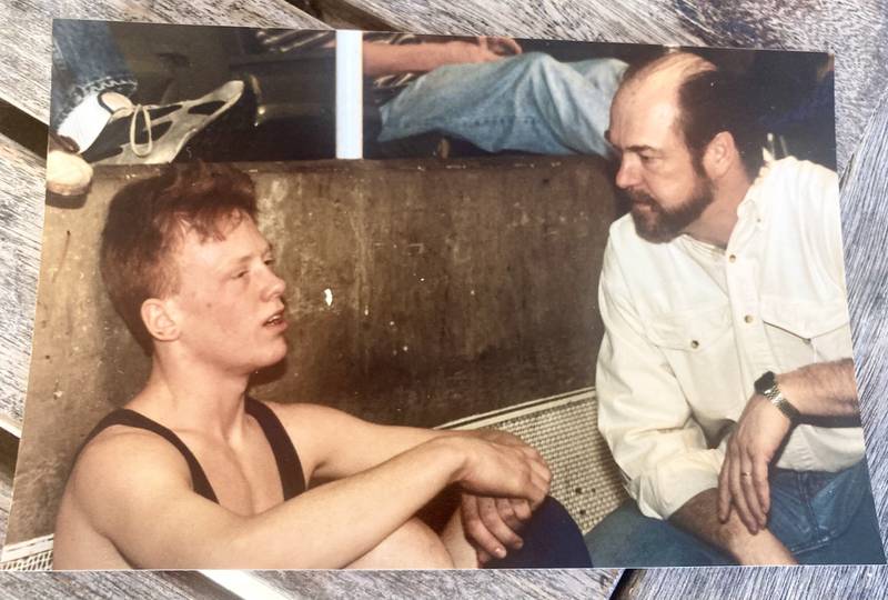 The late Princeton coach Randy Swinford consoles Josh Anderson, then a PHS senior during the 1996 IHSA State Wrestling Tournament at the Assembly Hall. Anderson, who placed third in the PIT that year, will be officiating this year's tournament at his alma mater.