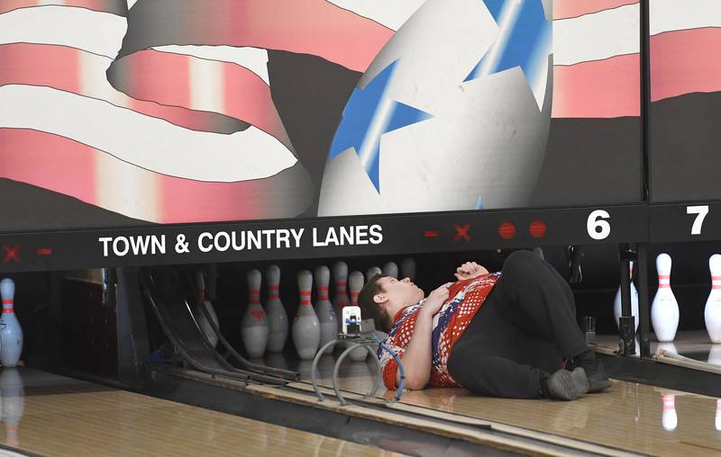 Oregon High School bowling coach AJ Nordman tends to a repair on one of the lanes during a match with Harvard at Town & Country Lanes in Mt. Morris on Friday, Dec. 19, 2025.