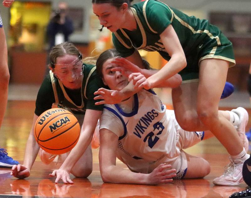 Boylan’s Zoey Schmidt, left, and Bailey Westlund, right, battle Geneva’s Nora Hatton, center, for the ball in girls IHSA Class 3A Sectional basketball on Tuesday, Feb. 24, 2026, at Crystal Lake Central High School in Crystal Lake.