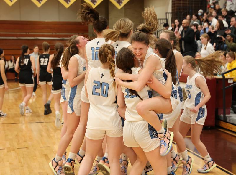 Nazareth celebrates their win after the girls 3A varsity super-sectional game between Nazareth Academy and Fenwick High School in River Forest on Monday, Feb. 27, 2023.
