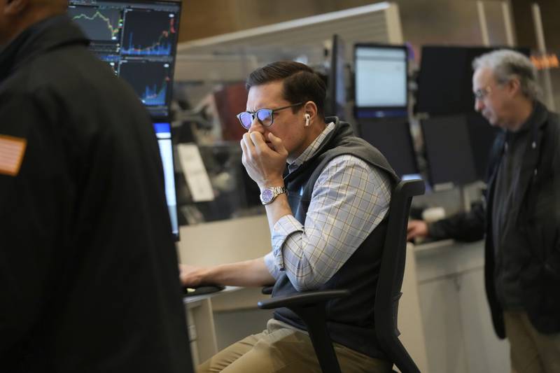 People work on the options floor at the New York Stock Exchange in New York, Tuesday, March 4, 2025. (AP Photo/Seth Wenig)