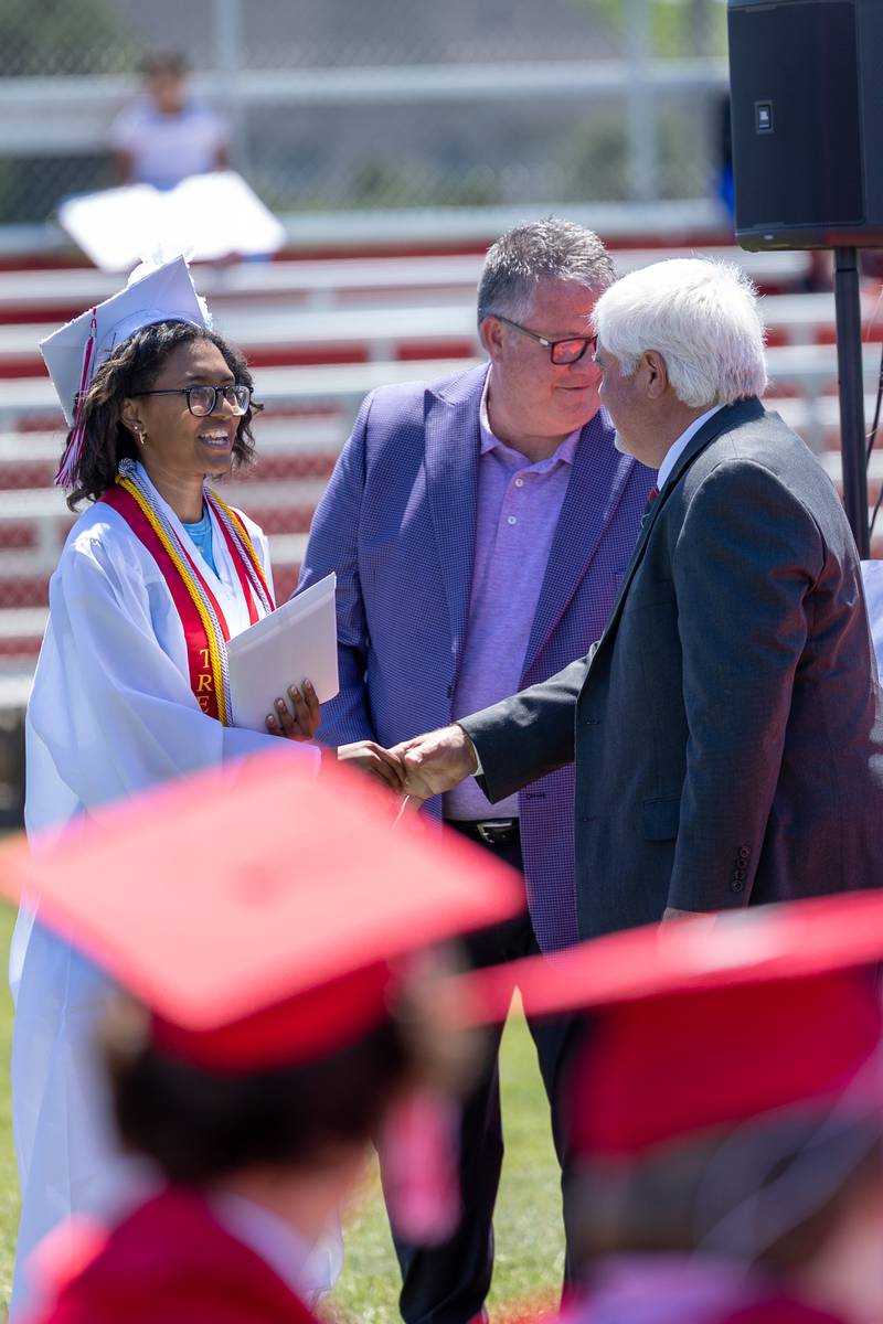 Graduate shakes hand of Administrator on Sunday, May 18, 2025 at Hall High School in Spring Valley.