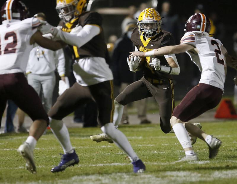 Jacobs' Joey Scrivani tries to get away from the pursuit of Brother Rice's Jack Morrison during a IHSA Class 7A first round playoff football game Friday, Oct. 28, 2022, between Jacobs and Brother Rice at Jacobs High School in Algonquin.