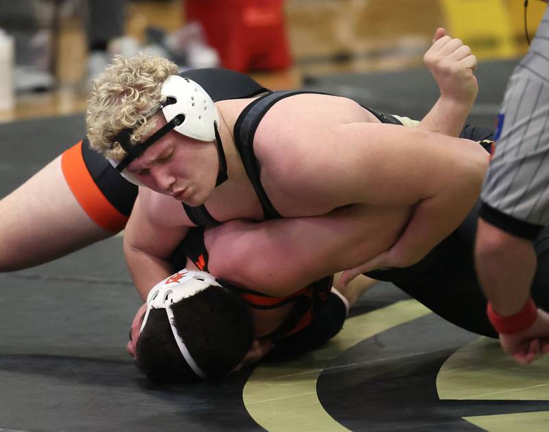 Sycamore’s Collin Hughes pins DeKalb’s 
Nicholas Waddle at 285 pounds Friday, Jan. 16, 2026, at Sycamore High School.