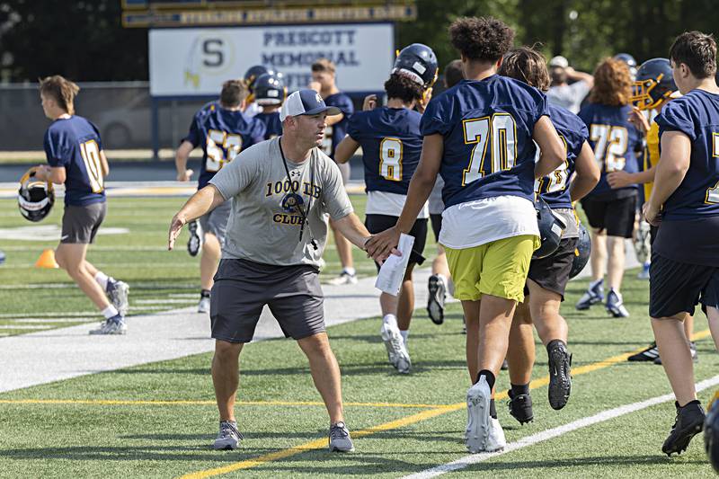 Sterling coach Jon Schlemmer celebrates his team during first day of football practice Monday, August 7, 2023.