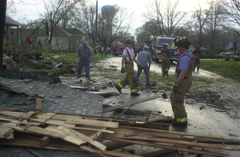Emergency personnel help clean debris after a tornado on Tuesday, April 20, 2024 in Granville.