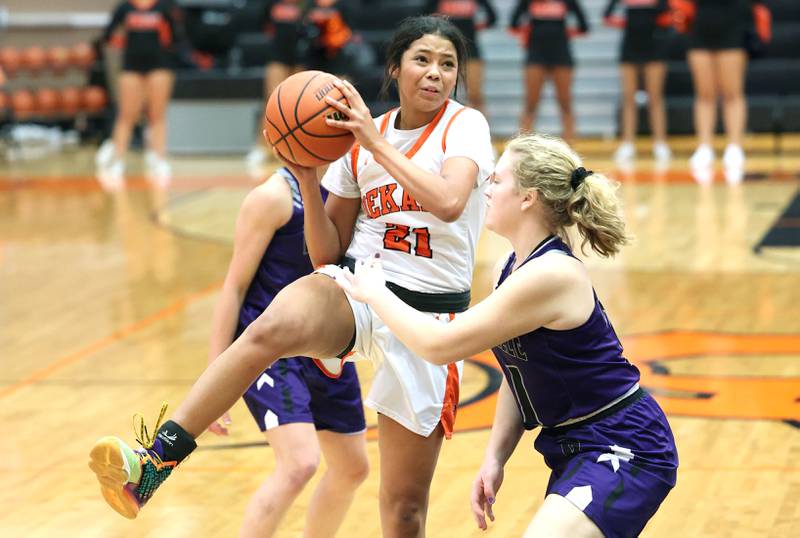 DeKalb's Alicia Johnson goes to the basket against Rochelle's Abby Metzger during their game Monday, Nov. 28, 2022, at DeKalb High School.