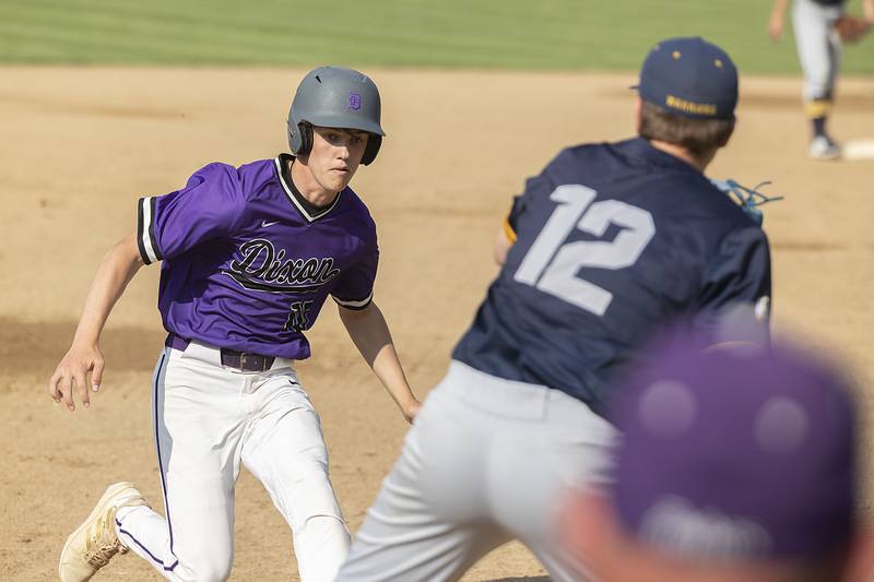 Dixon’s Bryce Feit is tagged out at third by Sterling’s Drew Nettleton Tuesday, May 16, 2023.