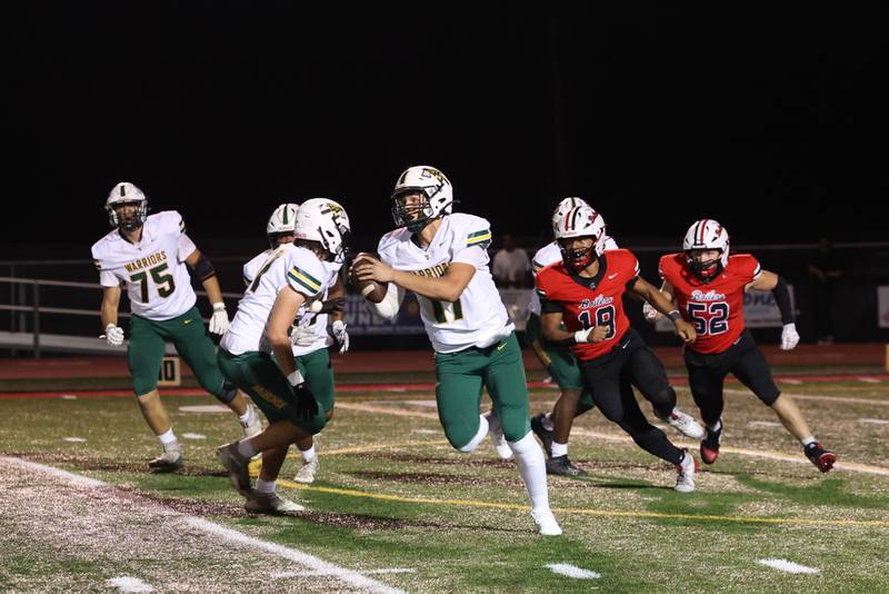 Waubonsie Valley quarterback Colin Ford runs the ball during the Warriors' 35-6 loss to Bradley-Bourbonnais on Friday, Sept. 12, 2025.