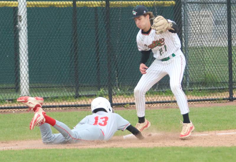 Ottawa's Rizon Contreras slides safely back into third base as L-P's Grey Ernat on Thursday, April 30, 2026 at Huby Sarver Field in the L-P Athletic Complex in La Salle.