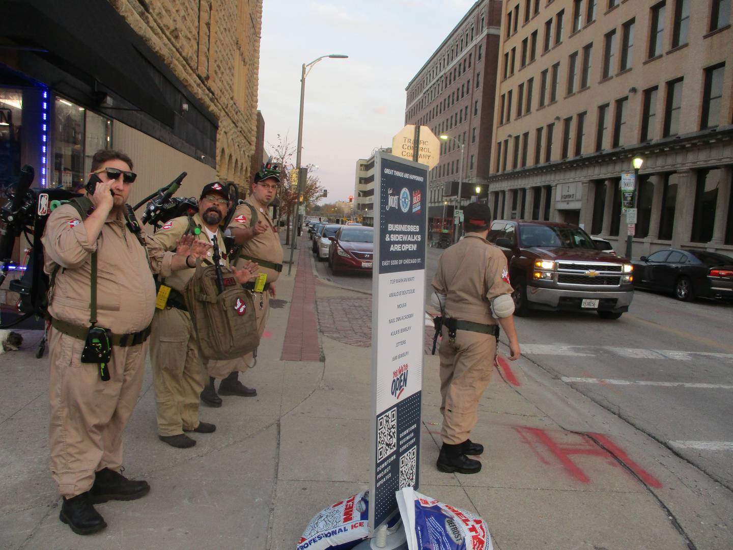 Guys costumed as Ghostbusters head for a ghost tour at the Rialto Square Theatre in downtown Joliet during Spirits With the Spirits night on Wednesday. Oct. 30, 2024