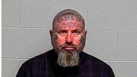Two men charged in beating at Fox Lake business