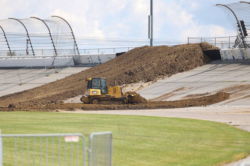 A bulldozer works on the dirt track on Tuesday for the motocross course at the Chicagoland Speedway as crew setup for Saturday’s SuperMotocross World Championship Finals in Joliet.