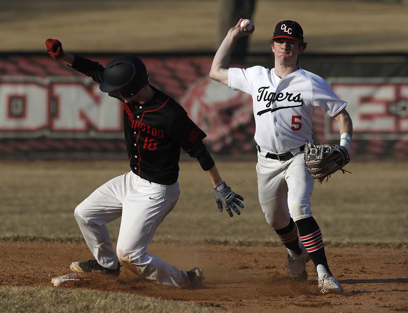 Crystal Lake Central’s Aidan Alig tries to turn a double play after forcing out Barrington’s  James Ensign during a non-conference baseball game Tuesday, March 15, 2022, between Crystal Lake Central and Barrington at Barrington High School.