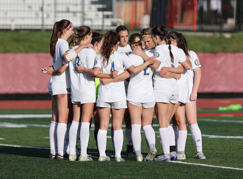 Lyons Township huddles up at the half during the girls varsity soccer match between Lyons Township and Hinsdale Central high schools in Hinsdale on Tuesday, April 18, 2023.