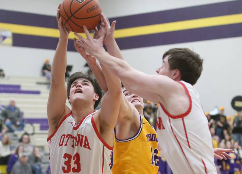 Ottawa's Cooper Knoll and teammate Kyler Araujo grab a rebound over Mendota's Braiden Freeman on Tuesday, Feb. 13, 2024 at Mendota High School.