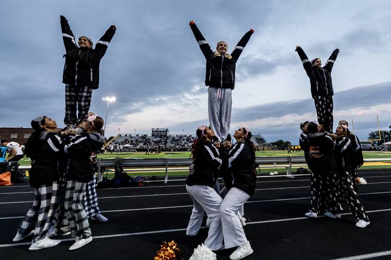 Plainfield East’s varsity cheer team performs prior to a varsity football game against Joliet West at Joliet West on Oct. 10, 2025.