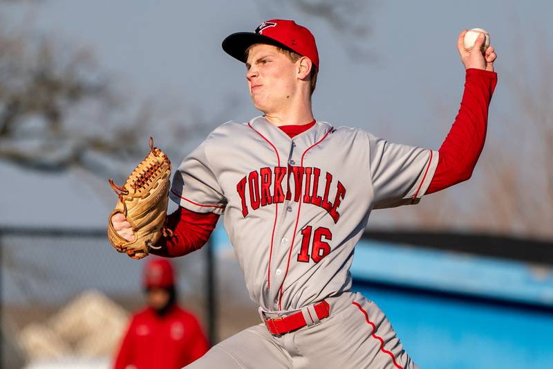 Yorkville's Simon Skroch (16) delivers a pitch against Marmion during a baseball game at Marmion High School in Aurora on Tuesday, Mar 28, 2023.