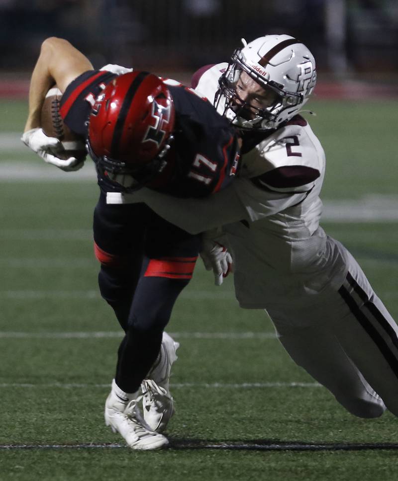 Huntley's Jacob Marx is tackled by Prairie Ridge's Logan Thennes during a Fox Valley Conference football game on Friday, Oct. 3, 2025, at Huntley High School.