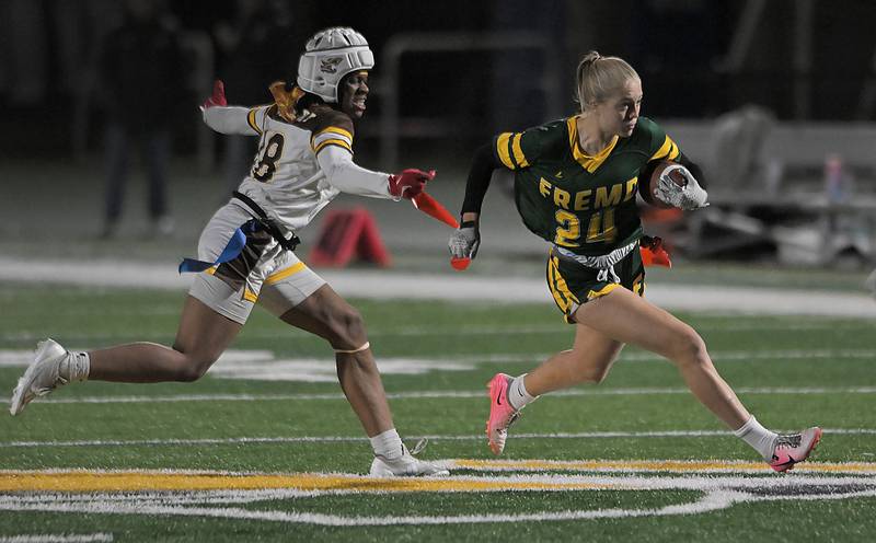 Fremd’s Gwen Zimmerman is stopped by Carmel’s Ayo Akingbesote in the Stevenson Sectional final girl flag football game in Lincolnshire on Wednesday, Oct. 16, 2024.