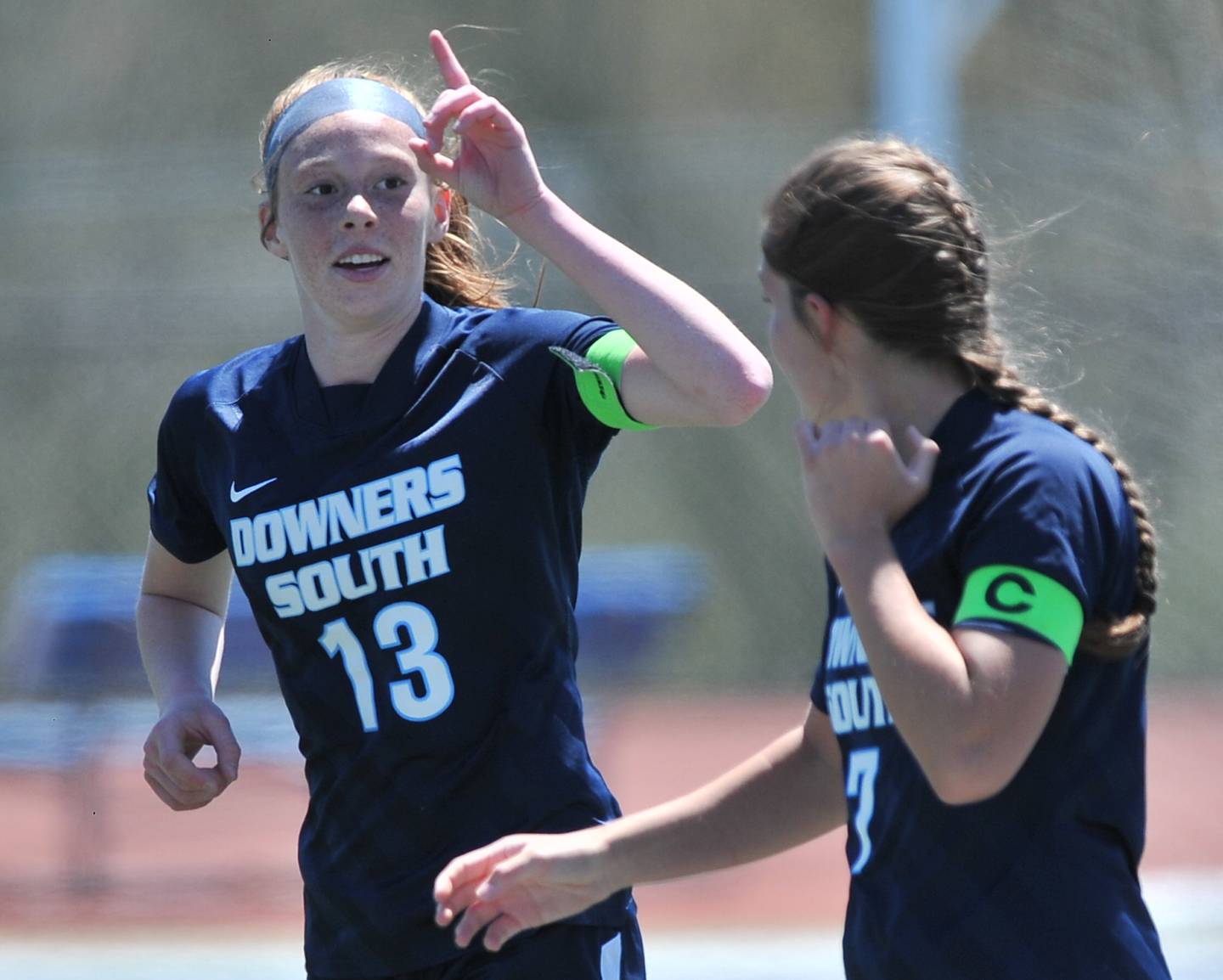 Downers Grove South's Emily Petring (13) signals to the crowd after scoring the first goal of the game against Downers Grove North on May. 7, 2022 at Downers Grove South High School.