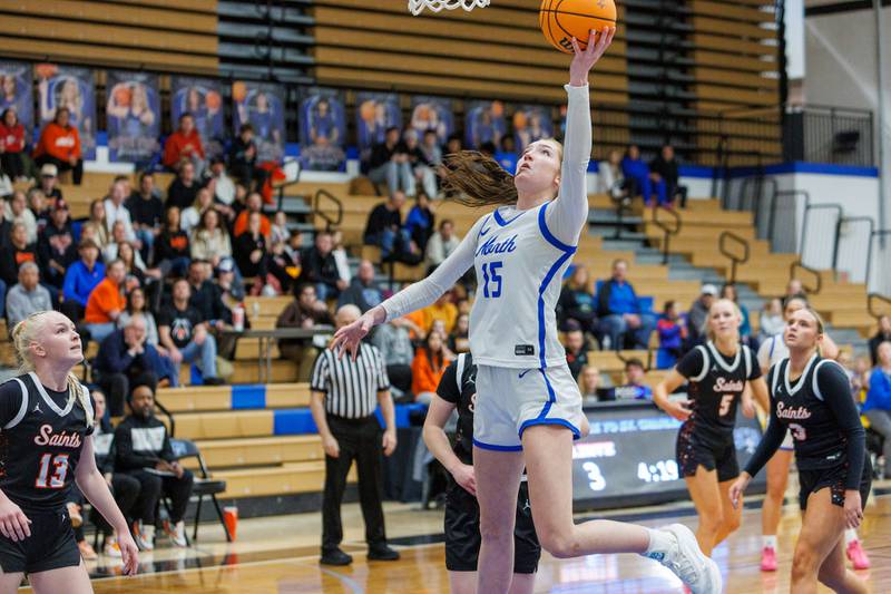 St. Charles North's Bronwyn How goes in for the layup against St. Charles East on Jan. 30, 2026 in St. Charles.