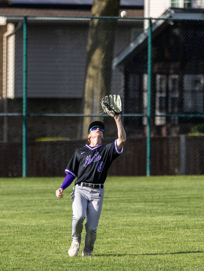 Downer’s Grove North outfielder Drake Cosenza catches a fly ball during a game against Lyons Township in Downers Grove on Monday, May 12, 2025.