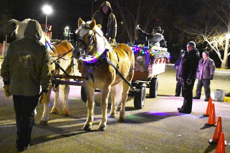 The Ellingston family from Poplar Grove offered horse-drawn wagon rides at the Centennial Park holiday lights display in Rock Falls on Friday, Dec. 19, 2025.