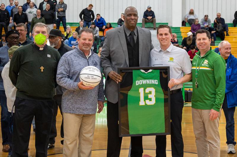 Providence Catholic recently honored Walter Downing (at center), the school's all-time leading scorer, upon his retirement from teaching at Hinsdale South.