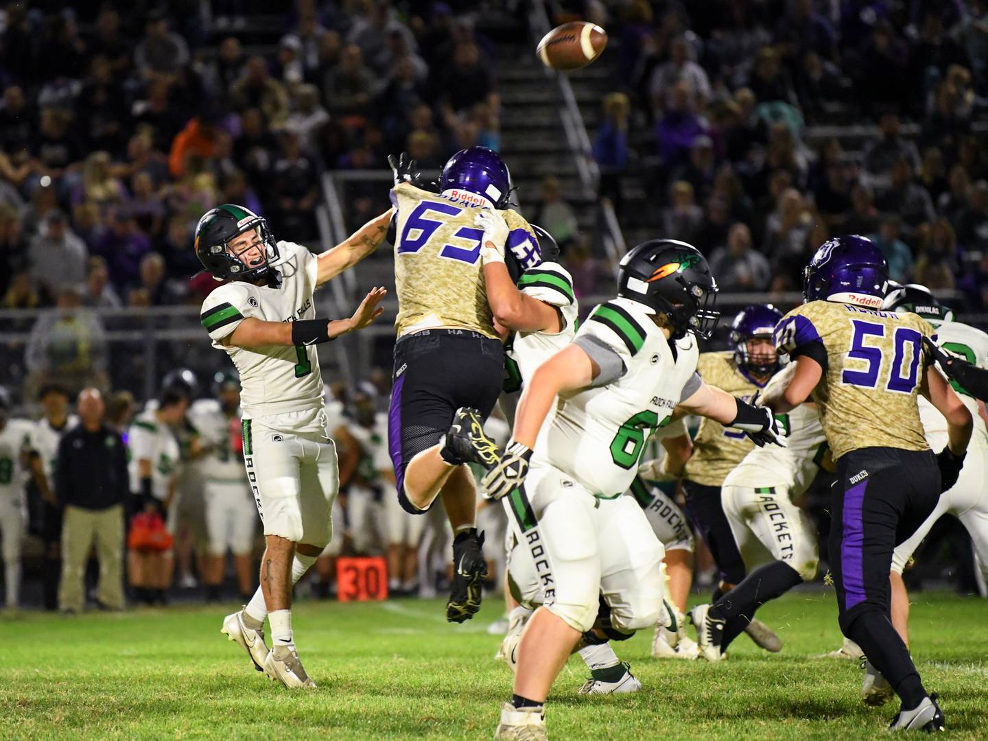 Rock Falls quarter back Easton Canales gets the ball away during a game against Dison in Rock Falls on Friday, Sept. 8, 2023.