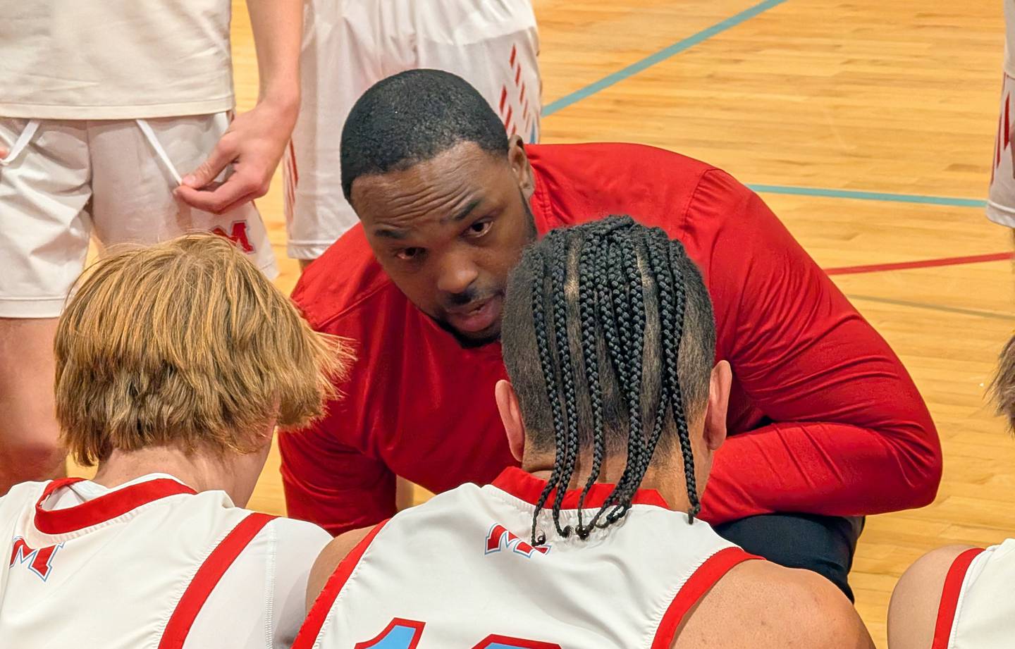 Marian Central boys basketball coach Lafeyette Bell talks to his team during a timeout against Christian Life on Tuesday, Dec. 2, 2025, in Woodstock.