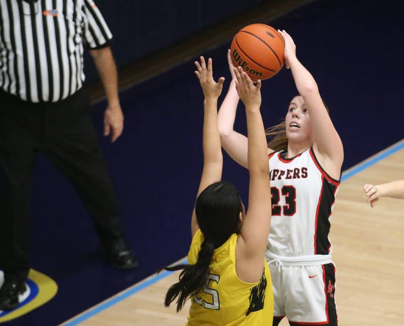 Amboy's Maeve Larson eyes the hoop as Putnam County's Esmeralda Avila defends during the Class 1A Regional semifinal game on Monday, Feb. 12, 2024 at Marquette High School.