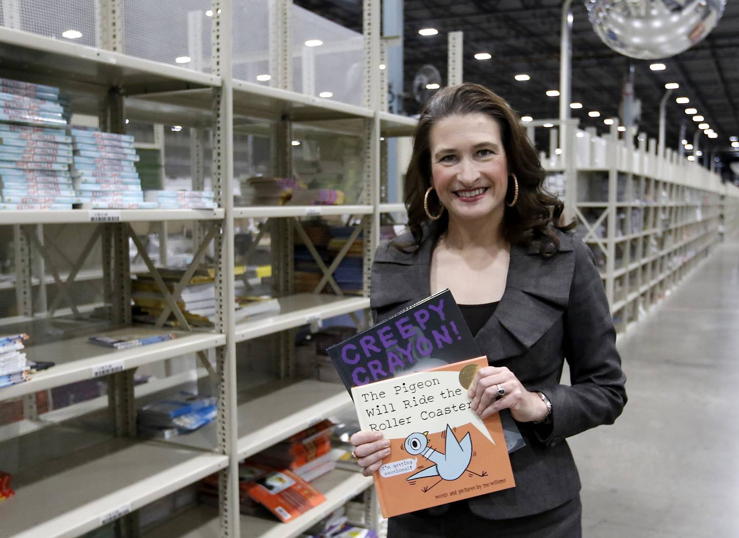 Follett Content Chief Operating Officer Britten Follett inside the warehouse of Follett Content on Tuesday, Dec. 10, 2024, She is the fifth generation of the family to leading the McHenry-based company.