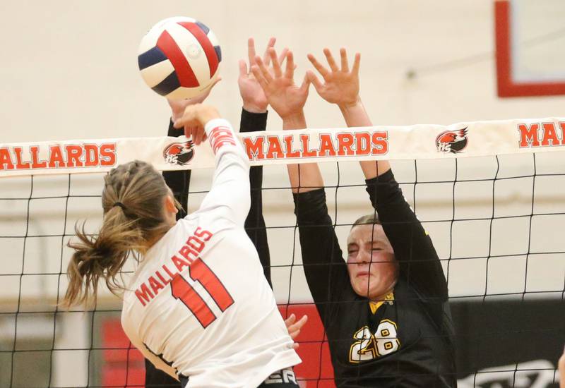 Putnam County's Kennedy Holocker blocks a spike from Henry-Senachwine's Alison Mitchell on Thursday, Aug. 28, 2025 at Henry-Senachwine High School.