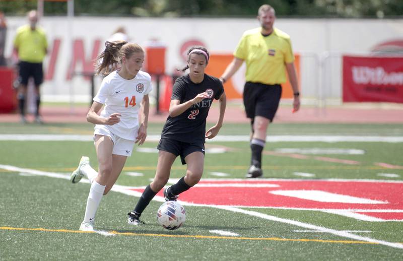 Crystal Lake Central’s Hadley Ferrero (left) and Benet’s Rania Fikri go after the ball during a Class 2A girls state soccer semifinal at North Central College in Naperville on Friday, June 2, 2023.