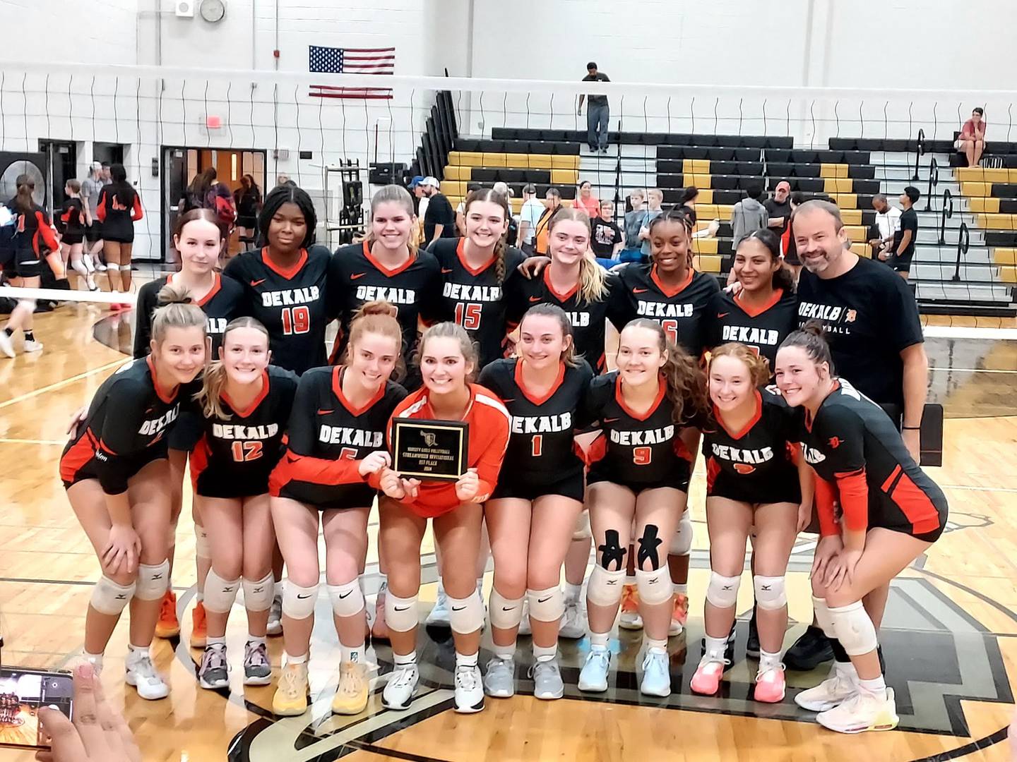 The DeKalb volleyball team celebrates its first place finish at the Streamwood Invitational on Saturday, September 21, 2024.