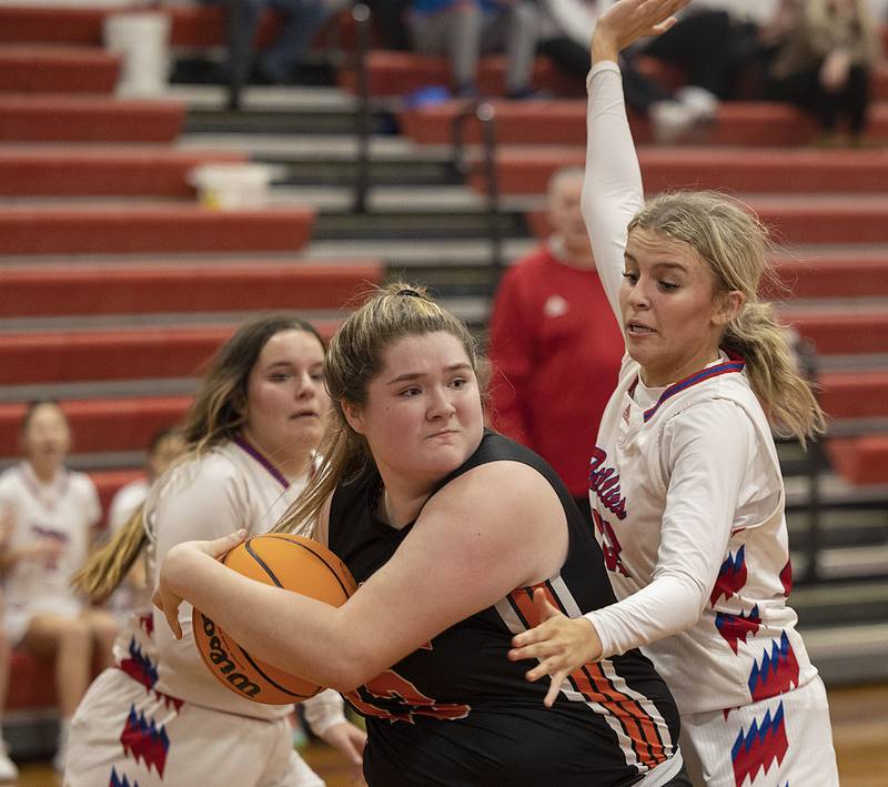 Milledgeville’s Olivia Wooden keeps the ball away from Morrison’s Avery White Wednesday, Jan. 22, 2025.