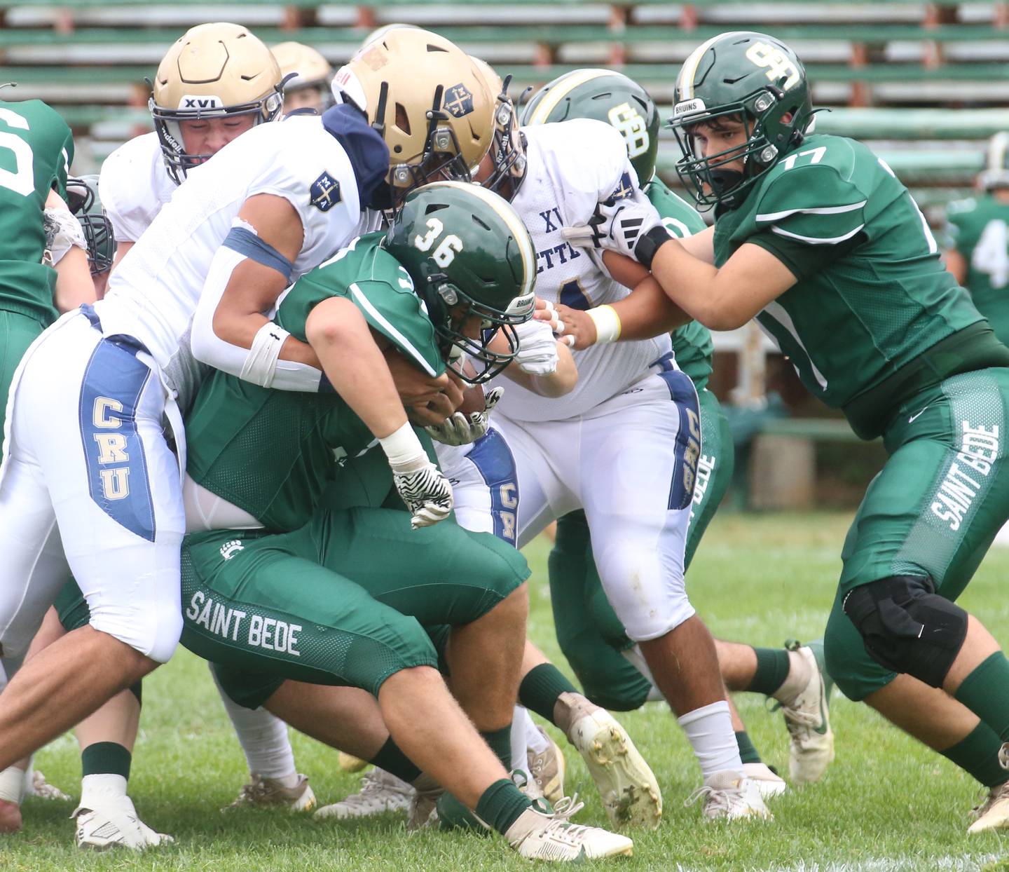 St. Bede's Landon Marquez gets pushed back by Marquette's Blayden Cassel during the Homecoming game on Saturday, Sept. 28, 2024 at St. Bede Academy.