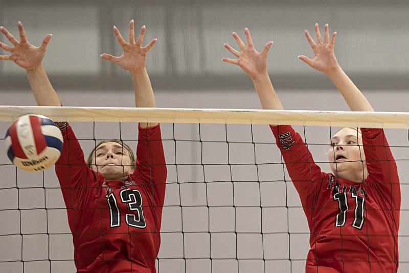 Erie-Prophetstown’s Kennedy Buck (left) and Lauren Abbott go up to block a shot against Rochelle Saturday, Sept. 30, 2023 during the Sterling Volleyball Invitational held at Challand Middle School.