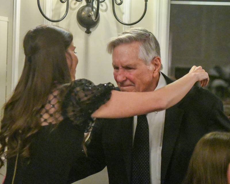 Harrison Schneider gets a hug from his granddaughter Brianna Wynne after Harrison was named Charlemagne Award winner on Friday May 1, 2026.