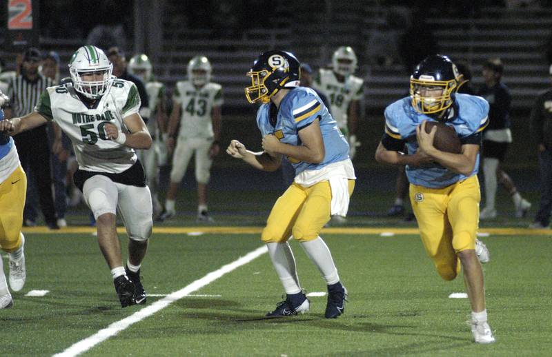 Wyatt Cassens runs the ball in the fourth quarter of Sterling's game. Niles North traveled to Sterling High School to play the Warirors on Sept. 6, 2024