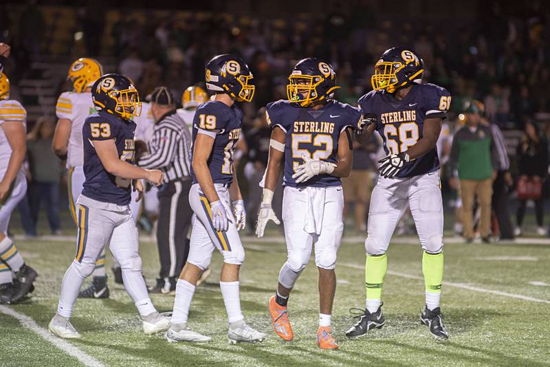 The Sterling defense comes off the field after making a stop Friday, Sept. 23, 2022 against Geneseo.