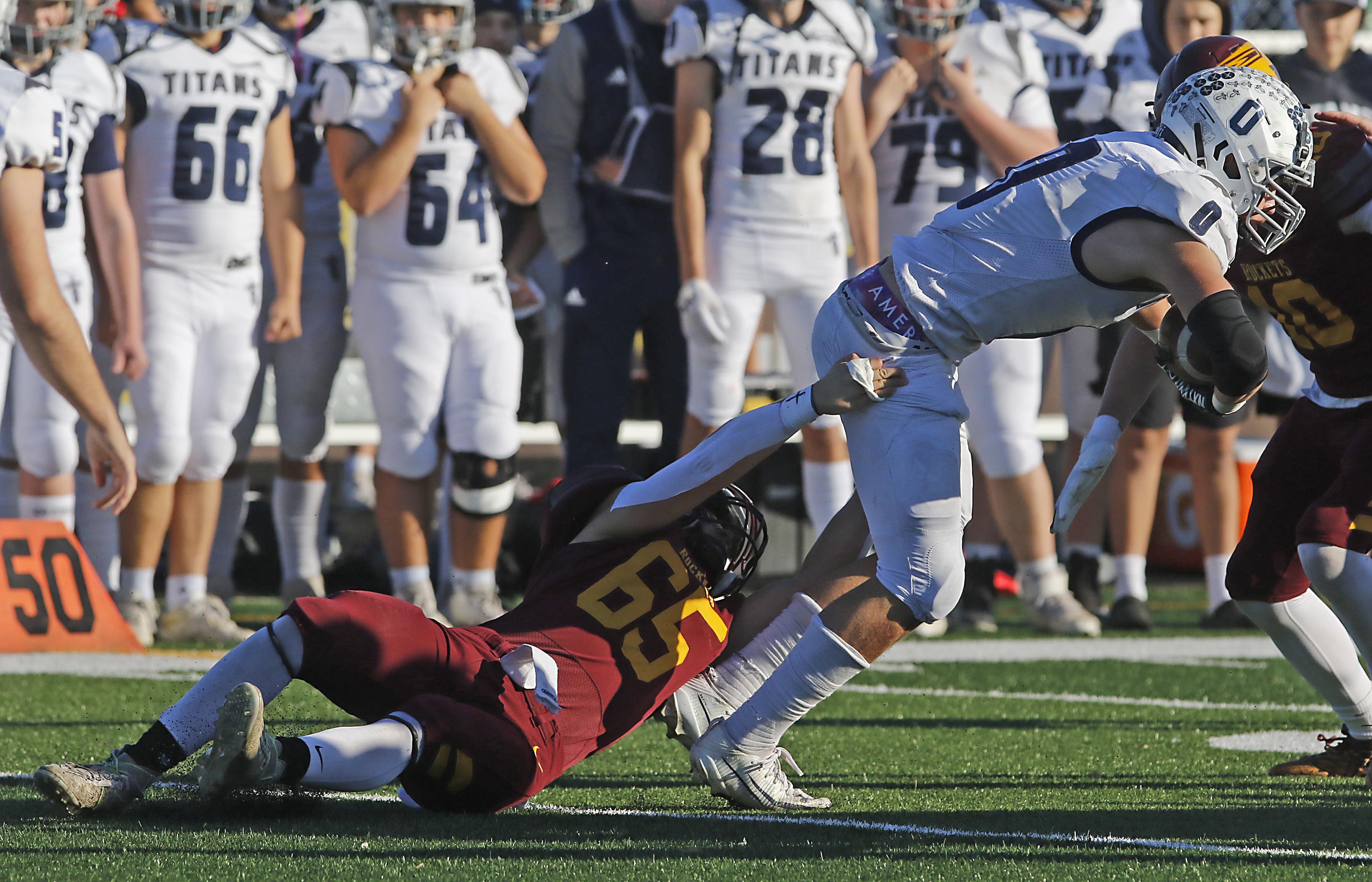 Richmond-Burton's Trevor Szumanski tries to tackle Monmouth-Roseville's Nick Huston during an IHSA Class 3A quarterfinal playoff football game on Saturday, November 15, 2025, at Richmond-Burton High School, in Richmond.