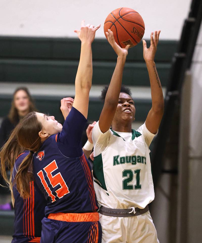 Kishwaukee College's Raven Meeks goes to the basket against Highland Community College's Sarah Kempel during their game Thursday, Jan. 11, 2024, at Kishwaukee College in Malta.