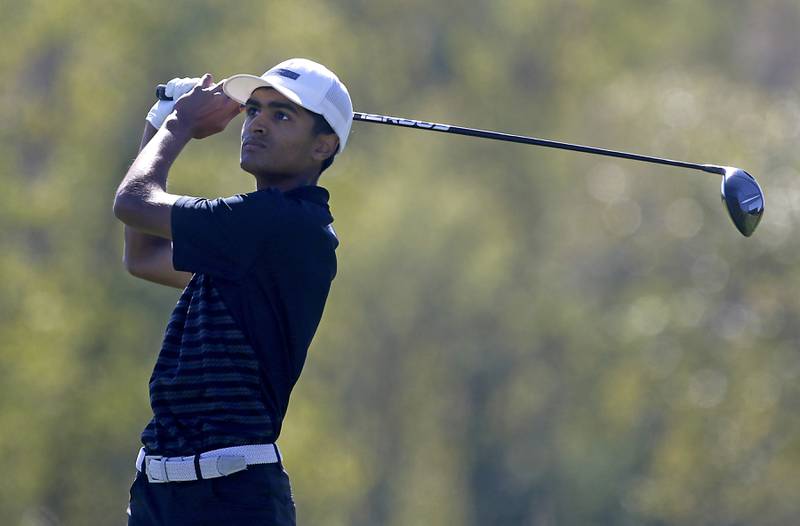 Huntley’s Taig Bhathal watches his tee shot on the ninth hole during the IHSA Class 3A Dundee-Crown Regional golf tournament on Wednesday, Oct. 2, 2024 at Randall Oaks Golf Club in West Dundee.
