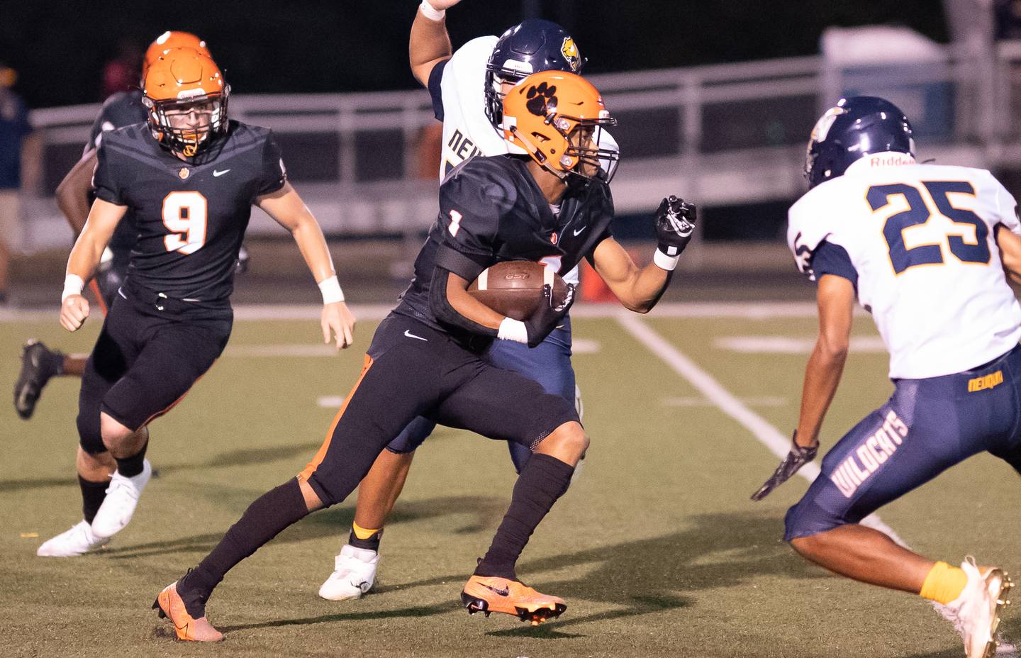 Wheaton Warrenville South's Reece Young (1) carries the ball against Neuqua Valley during a football game at Wheaton Warrenville South High School in Wheaton on Friday, Sep 3, 2021.
