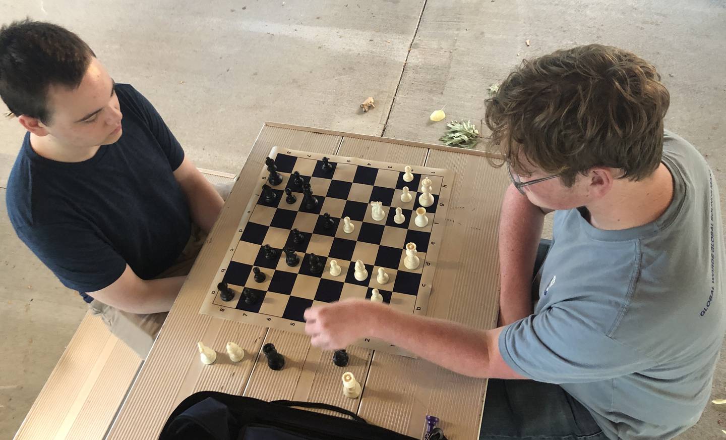 Zach Martin, left, 19, and Jake Miller, 17, have played chess since they were young boys, learning from their fathers, and set up a board on Tuesday, Sept. 20, 2022, at Veterans Memorial Park.